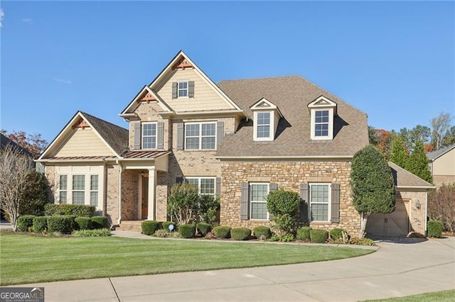 view of front of house with a garage and a front yard