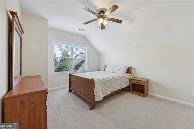 carpeted bedroom featuring ceiling fan and lofted ceiling