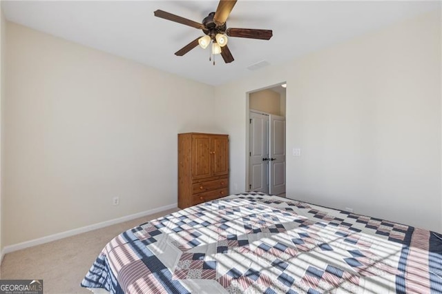 unfurnished bedroom featuring light colored carpet and ceiling fan