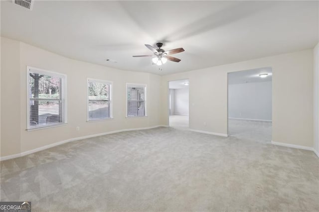 carpeted empty room with ceiling fan