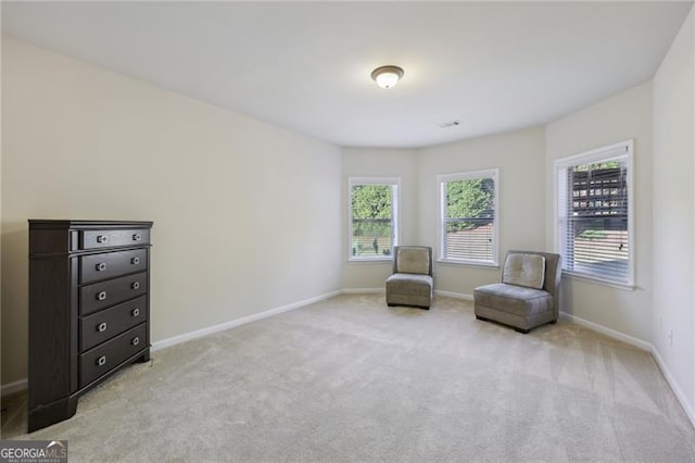 unfurnished room featuring light colored carpet