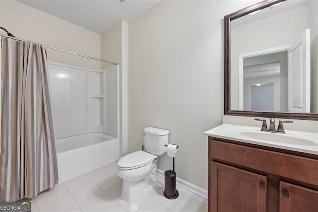 full bathroom featuring tile patterned floors, shower / bath combo with shower curtain, vanity, and toilet