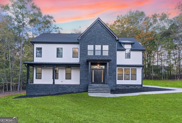 view of front of house with a lawn