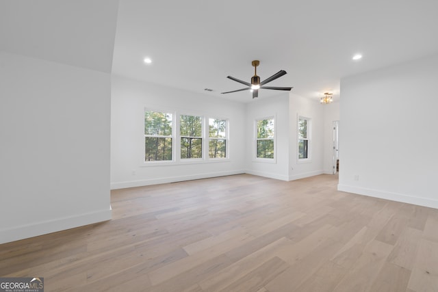 unfurnished living room with light hardwood / wood-style flooring and ceiling fan