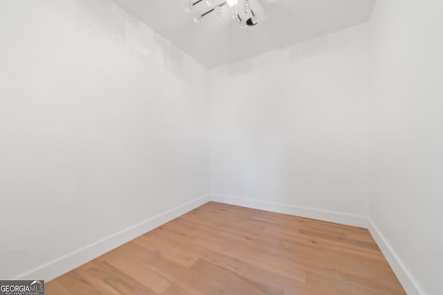 spare room with hardwood / wood-style flooring