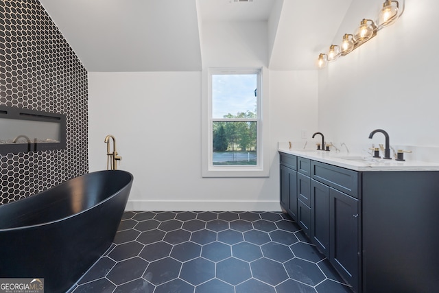 bathroom featuring a tub to relax in and vanity