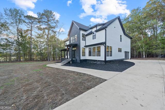 view of side of property featuring a garage