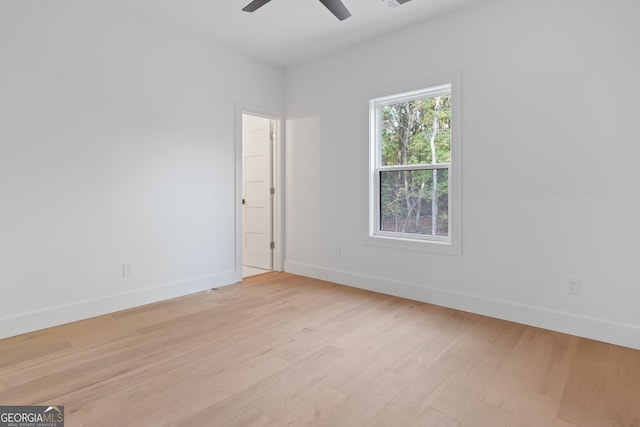 unfurnished room with ceiling fan and light hardwood / wood-style floors