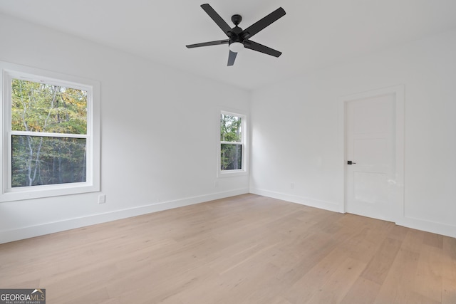 spare room with light hardwood / wood-style floors and ceiling fan