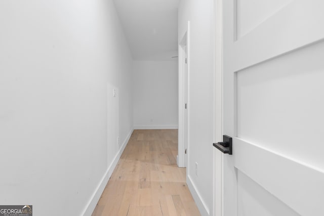 hall with light hardwood / wood-style flooring