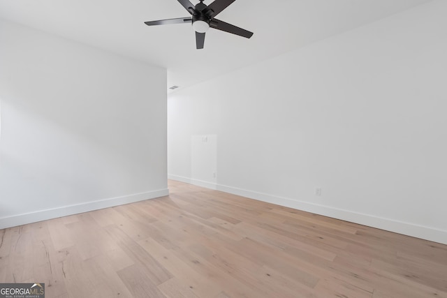 spare room with ceiling fan and light hardwood / wood-style flooring