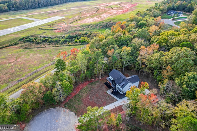 birds eye view of property featuring a rural view