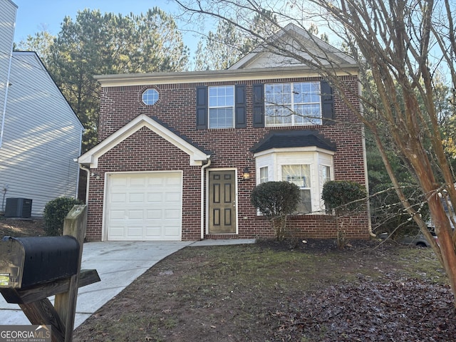 view of front of house featuring cooling unit and a garage