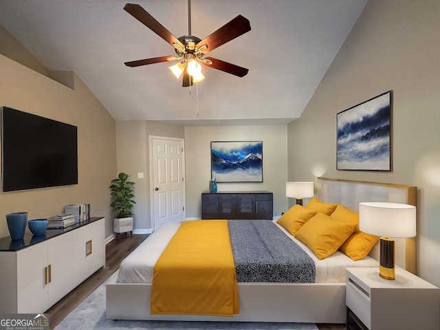 bedroom featuring wood-type flooring, ceiling fan, and vaulted ceiling