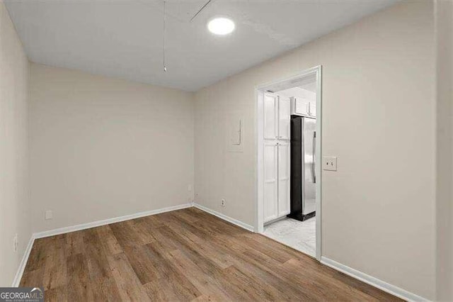 empty room featuring wood-type flooring