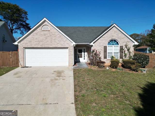 ranch-style home with a front lawn and a garage