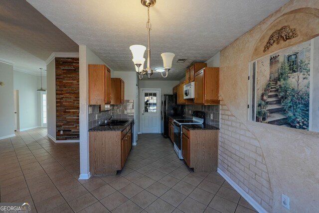 kitchen featuring pendant lighting, white range with electric stovetop, decorative backsplash, and a notable chandelier