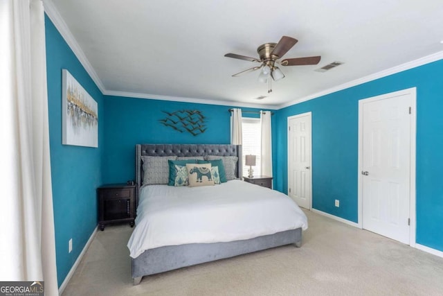 bedroom featuring ceiling fan, crown molding, and carpet floors