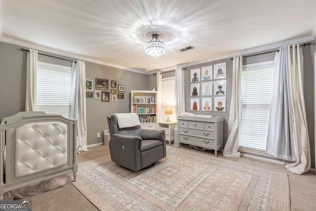 living area with a chandelier, light carpet, plenty of natural light, and crown molding