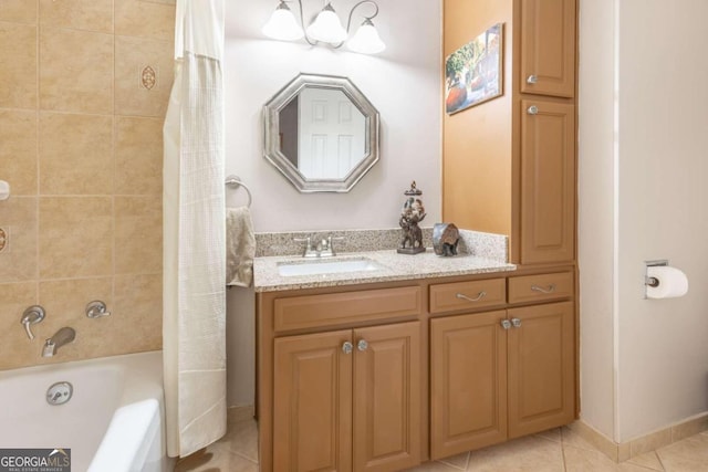 bathroom with vanity, tile patterned floors, and shower / bath combo with shower curtain