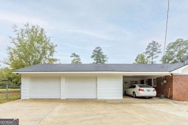 garage featuring a carport