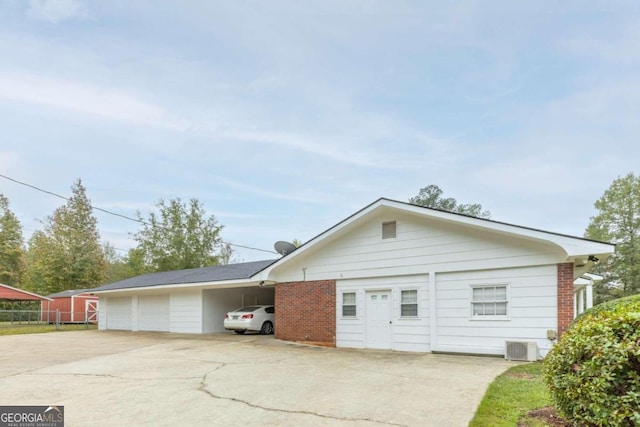 view of side of property with cooling unit