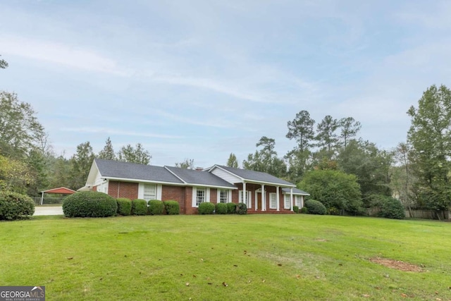 ranch-style home with a porch and a front lawn