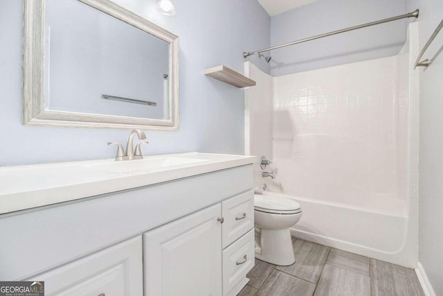 full bathroom featuring wood-type flooring, vanity, toilet, and shower / bathtub combination