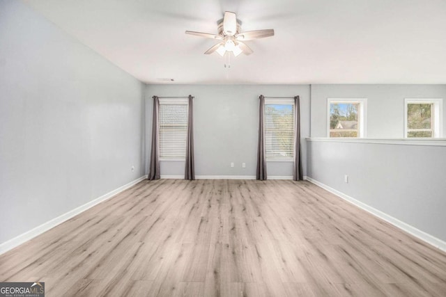 unfurnished bedroom with ceiling fan and light wood-type flooring