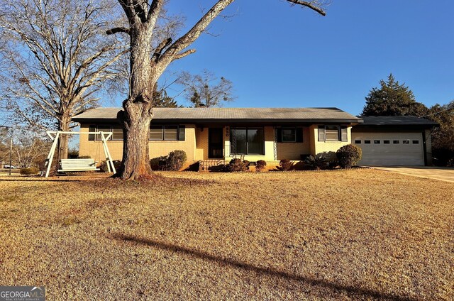 ranch-style home with a garage