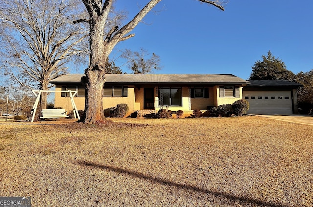 ranch-style home with a garage