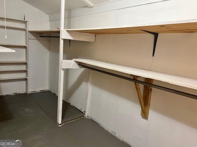 laundry area with washer hookup, electric dryer hookup, dark wood-type flooring, and cabinets