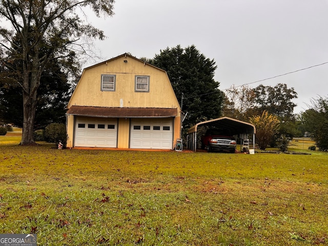 garage with a yard and a carport