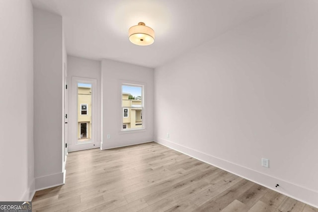 spare room featuring light wood-type flooring