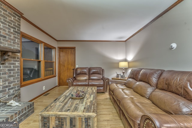 living room featuring light wood-type flooring and ornamental molding