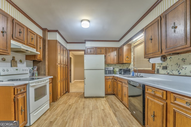 kitchen featuring white appliances, sink, crown molding, light hardwood / wood-style flooring, and decorative backsplash