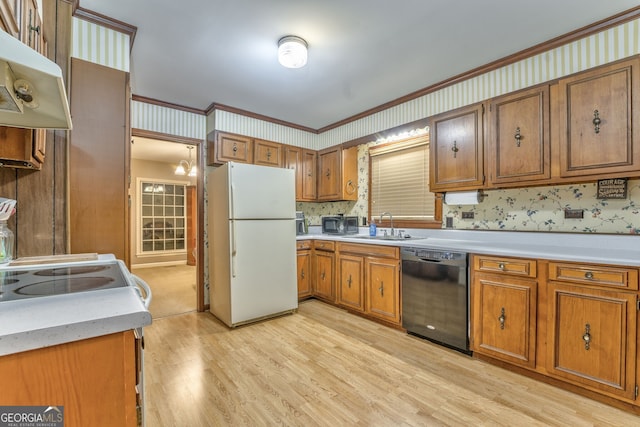 kitchen featuring ornamental molding, sink, white refrigerator, dishwasher, and light hardwood / wood-style floors