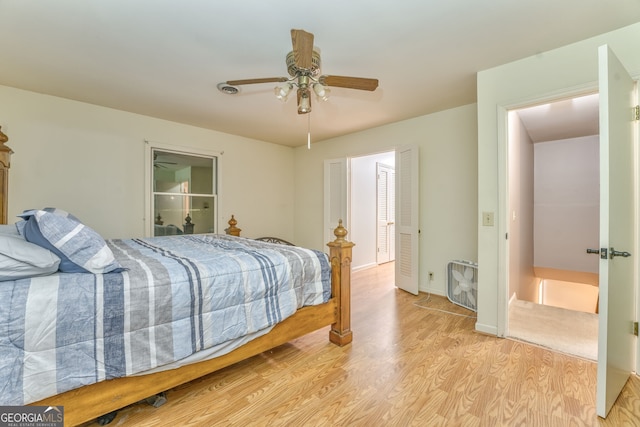 bedroom with ceiling fan and light hardwood / wood-style floors