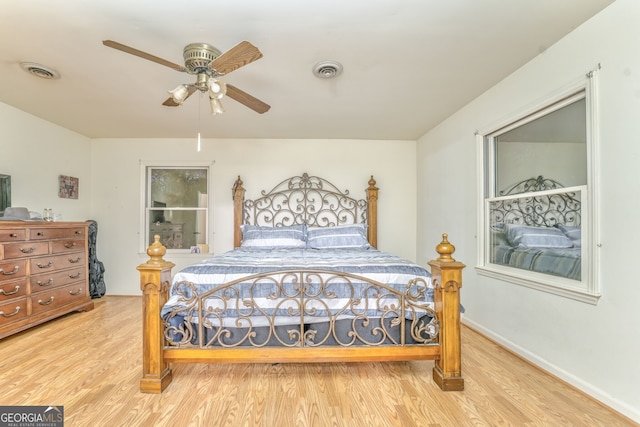 bedroom with hardwood / wood-style flooring and ceiling fan