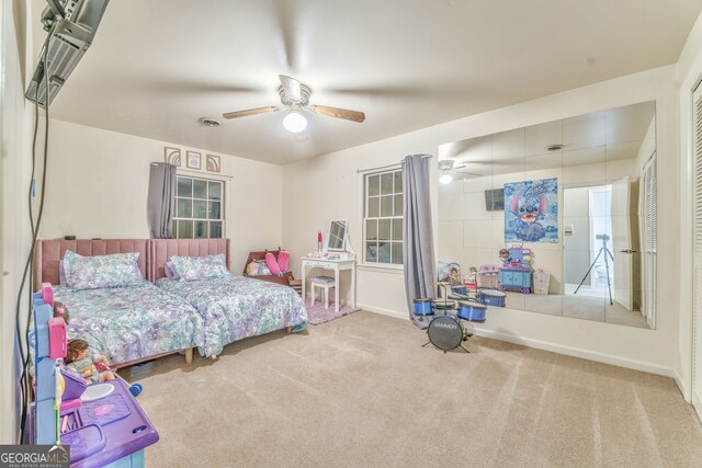 carpeted bedroom featuring ceiling fan