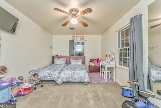 carpeted bedroom featuring ceiling fan