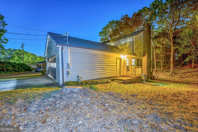 view of side of home with a garage