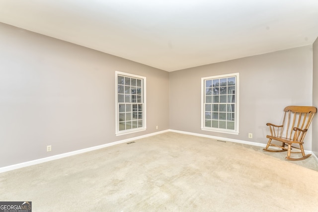 living area with light colored carpet