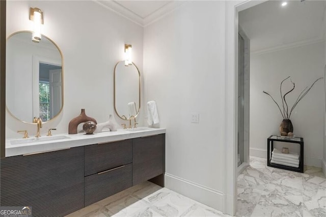 bathroom featuring marble finish floor, crown molding, and a sink