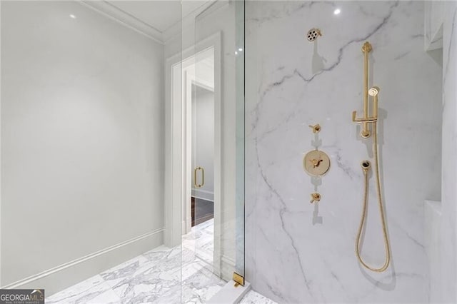 full bath featuring a marble finish shower and crown molding