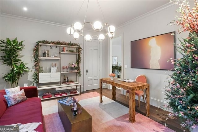 interior space featuring ornamental molding, a chandelier, and wood finished floors