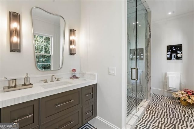 bathroom featuring baseboards, vanity, recessed lighting, and a marble finish shower