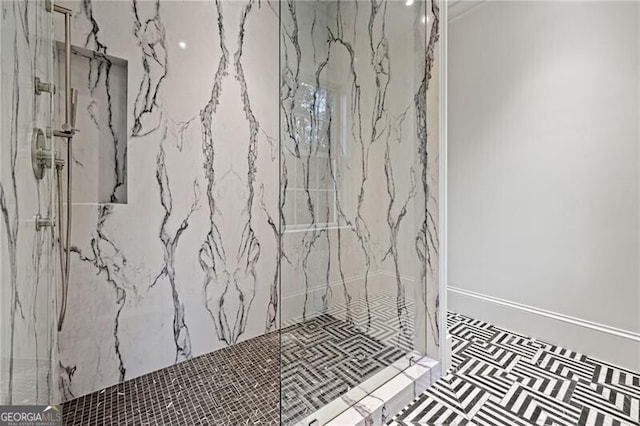 room details with a marble finish shower