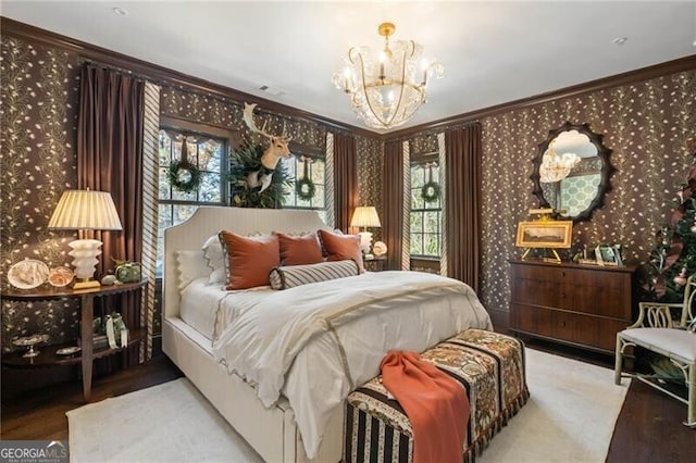 bedroom featuring wallpapered walls, a chandelier, and crown molding