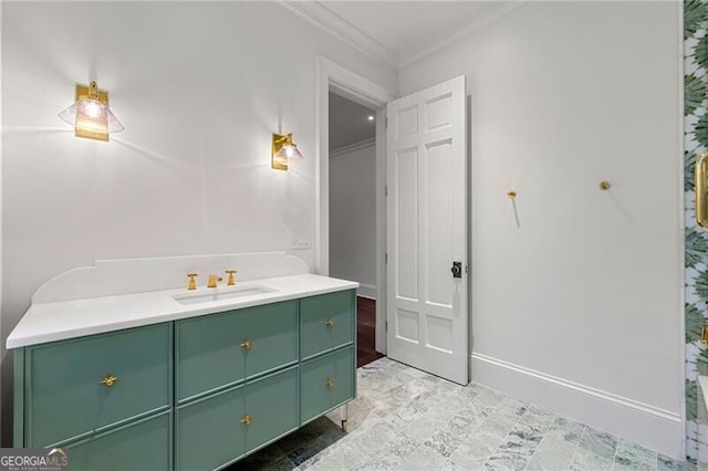 bathroom with baseboards, vanity, and crown molding